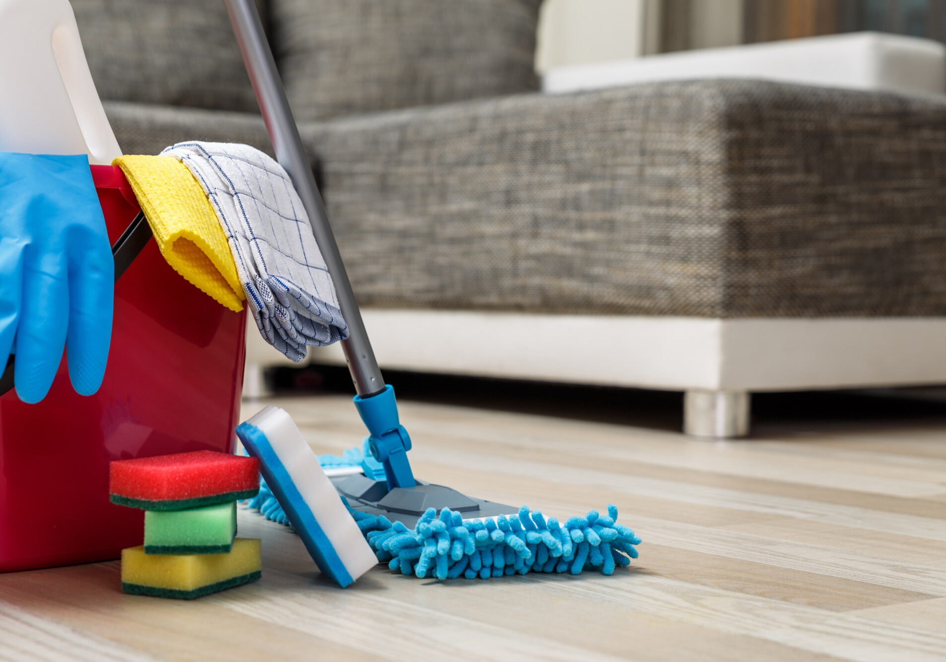 Cleaning service. Bucket with sponges, chemicals bottles and mopping stick. Rubber gloves and towel. Household equipment.